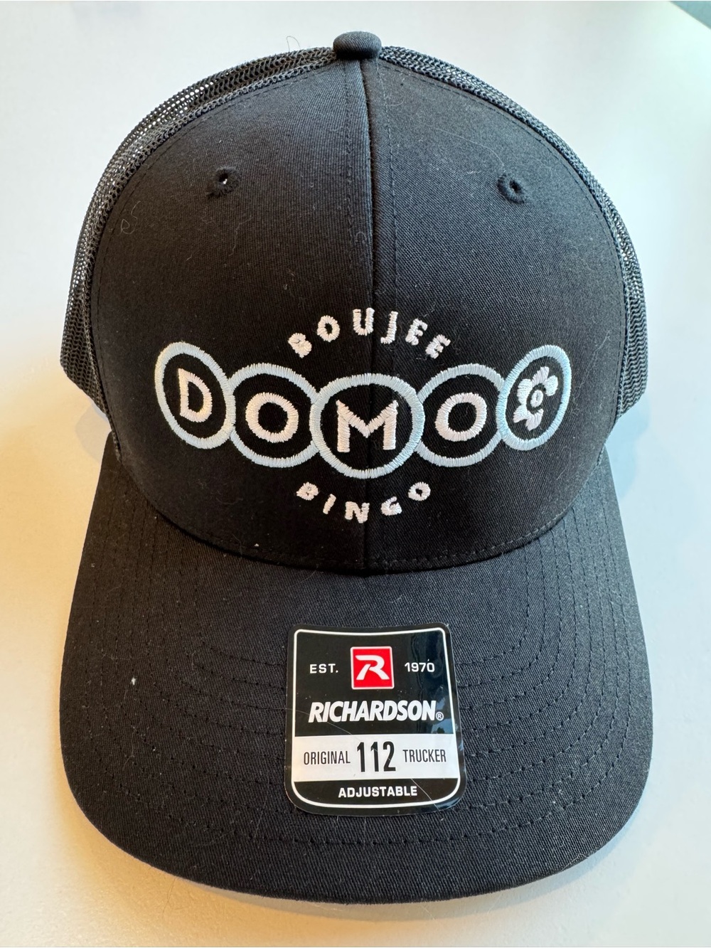 Black Domoo Trucker Hat - Embroidered Logo. Adjustable back,like new